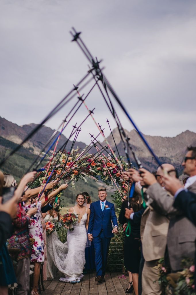 Wedding ceremony recession with ski poles in Colorado